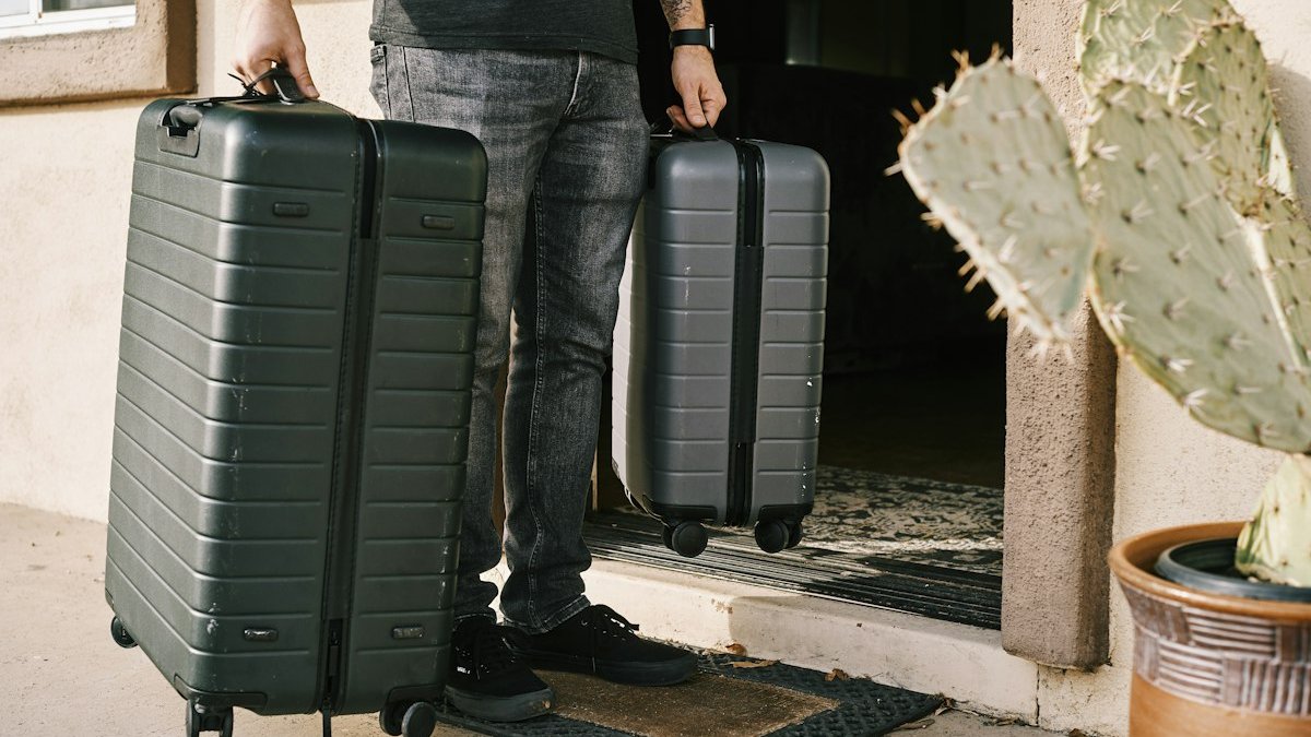 Passenger suitcase resting on baggage scale at airport check-in counter